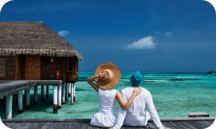 Couple enjoying a serene view at a Maldives water villa